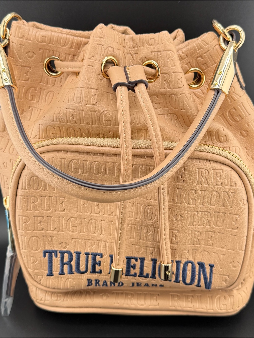 True Religion Embossed Drawstring Bucket Bag Tan Beige Monogram Gold Hardware NW